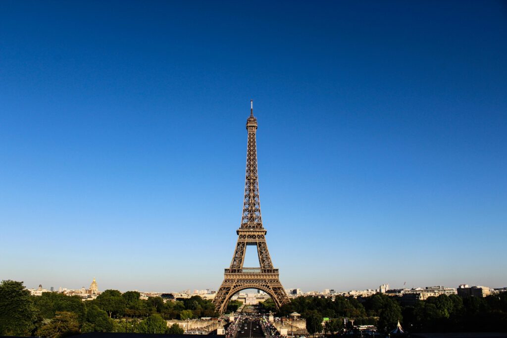 Stunning daylight shot capturing the Eiffel Tower with clear blue skies in Paris. Stunning daylight shot capturing the Eiffel Tower with clear blue skies in Paris.